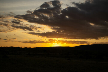 A moody sky at sunset in the hills