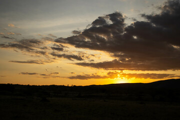 A moody sky at sunset in the hills 