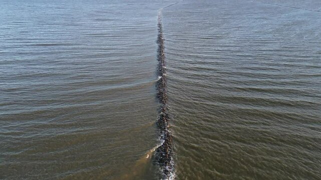 Low stone jetties protect harbour in Parnu, Estonia from silting up