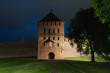 Obraz premium The Vladimir Passage Tower of the Kremlin in Veliky Novgorod. The facade of the Vladimir Tower. Fresco image of Nikola. High quality photo