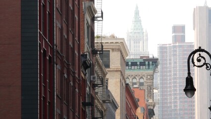 New York City Manhattan Soho fashion district near Broadway street. USA urban building facade, old american architecture. Shopping in NYC, United States. Business and residential real estate. Lantern.