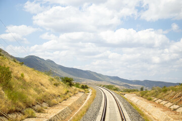 A view of railway tracks passing through the countryside