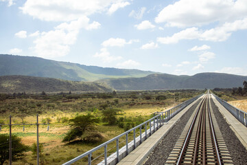 A view of railway tracks passing through the countryside