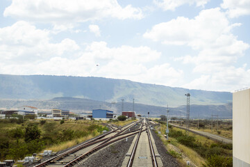 A view of railway tracks passing through the countryside