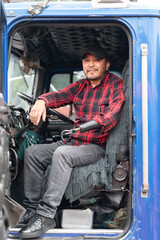 Portrait of a truck driver with a prosthetic arm