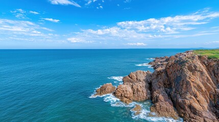 Fototapeta premium Breathtaking coastal landscape with rocky cliffs and azure ocean
