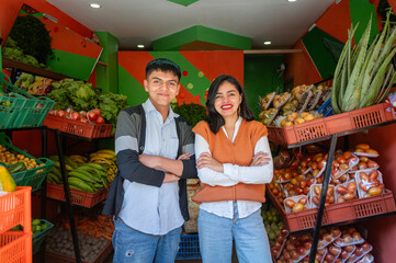 Couple posing in their fruit shop in Latin America