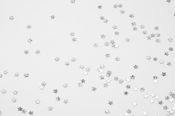 sparkles silver stars on white background with text place- Image