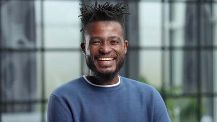 Confident black business man looking at camera with serious expression