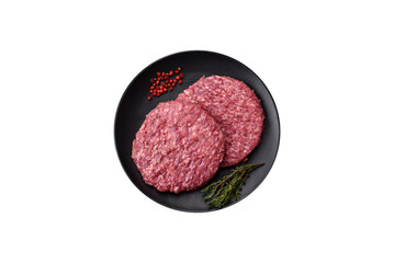 Fresh raw ground beef burger patty with salt and spices