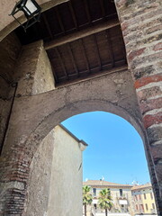 A look under the arch at the grandeur and power of the medieval walls of the castle, which have been miraculously preserved to this day.