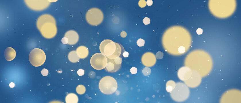 Colorful bokeh lights in various shapes. Dreamy winter holiday texture against a blue background.