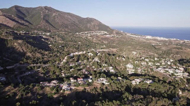 Take pleasure in a stunning aerial perspective of the beautiful mountains near the coast, Costa del Sol, Malaga, Andalucia, Spain