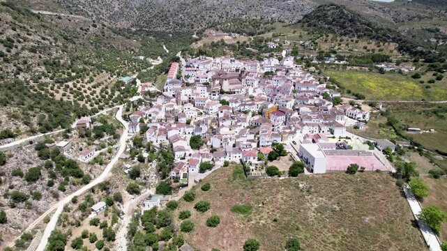 Aerial view of Andalusian town, surrounded by hills, with rich history and traditional architecture, Alpandeire, Malaga, Andalucia, Spain