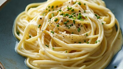 Luxurious linguine pasta with a truffle cream sauce on a plate