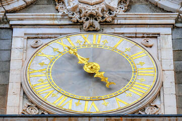 Close-up of the clock in the architectural capital at the Royal Palace, Madrid, Spain