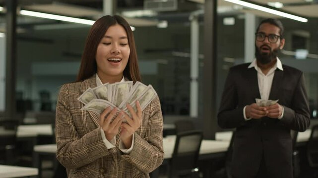 Unequal salary inequality wage discrimination Asian woman rich business girl businesswoman hold big money banknotes female office envy jealousy Indian businessman man male guy shock little finance