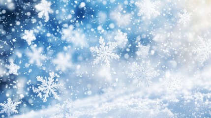 Fototapeta premium A beautiful wallpaper with many snowflakes falling. It shows a snowy sky with a mix of white and blue, creating a wintery scene.