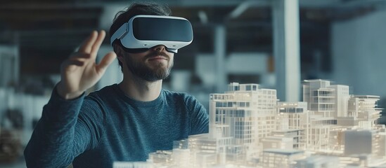A man wearing a VR headset interacts with a model of a city.