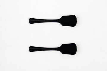 Black ice cream spoon on white background