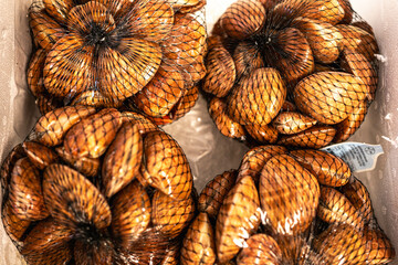 An overhead shot of shellfish in a net, capturing the essence of a day’s catch and the connection to the sea.