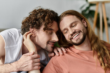 A loving couple shares an intimate moment, smiling and enjoying each other.