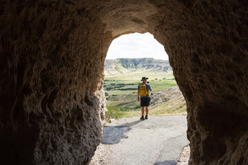 Hiker on the trail at the tunnel at Scotts Bluff National Monument, Nebraska