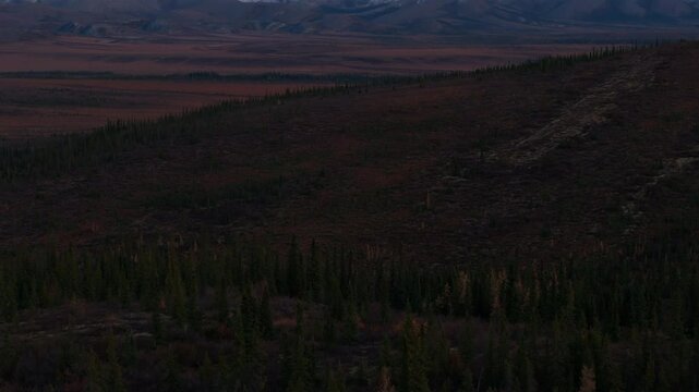 Snowy Mountains And Tundra Landscape At Sunset In Arctic Circle, Yukon, Canada. tilt-up reveal
