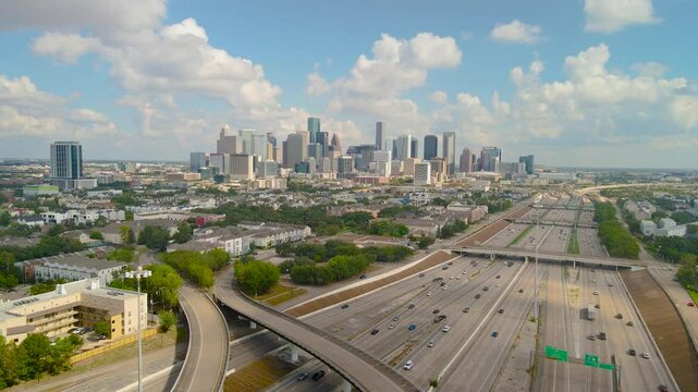 Outro drone shot Interstate Texas highway 288 and Downtown Houston Texas, Daylight skyline Aerial view. Downtown Houston pull out aerial shot with Freeway system, I45 Texas 288 and I69