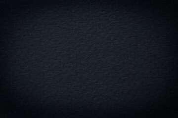 close up of dark anthracite color carboard texture shadowed at edge