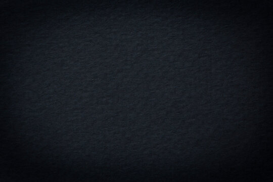 close up of dark anthracite color carboard texture shadowed at edge