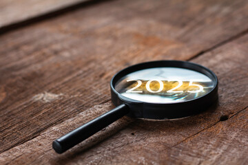 Number 2025 on magnifying glass, concept of starting something new