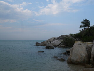 Obraz premium Bangka. Belitung. Bali. Indonesia. Beautiful beach view with large rocks, white sandy beach and rocky formations against bright blue sky, rugged nature