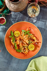 Grilled Shrimp with Lime on Orange Plate Gourmet Seafood Dish