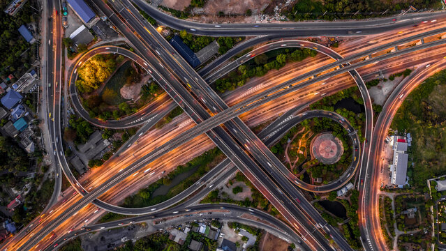 Aerial view elevated road and traffic junctions, Modern construction design traffic ways traffic jams, Road interchange or highway intersection with busy urban traffic Junction network transportation.