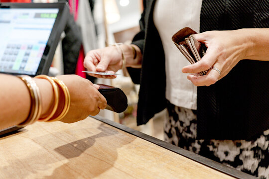 Customer Making a Payment at a Store Counter with Credit Card