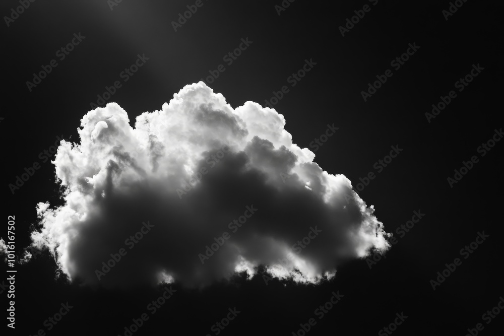 Aufkleber A solitary cloud floats in a dark sky, illuminated from behind, creating a striking contrast that highlights its fluffy texture and dramatic appearance.