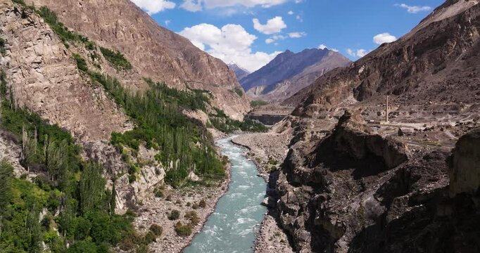 Establishing Drone Shot Above Hunza River, Karakoram Highway in Pakistan's Hunza Valley. Beautiful Summer Day