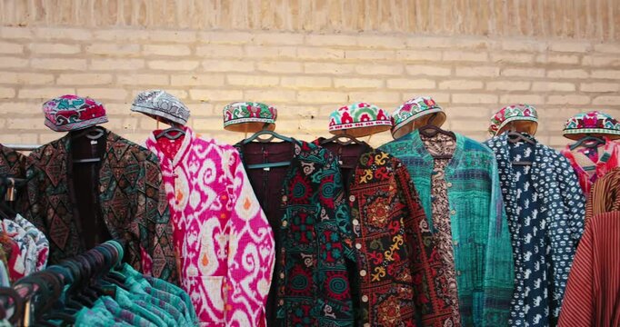 Khiva Uzbekistan Fortress Ichan Kala bright clothes oriental style. Street vendors in Khiva 1