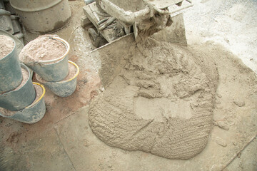 Concrete with cement mixer machine at construction site.
