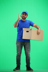 The deliveryman, in full height, on a green background, shows the ok sign