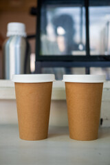 Two brown paper cup with white lid, eco friend