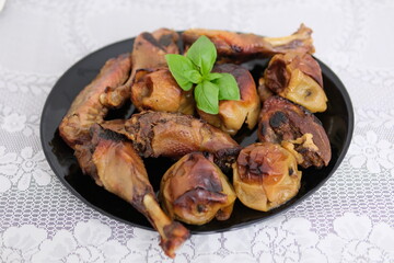 The cook spreads sauce on duck or goose stuffed with apples and lemon. Preparing roasted poultry. Carcass raw of duck or goose before baking watered with sauce. Process of preparing duck with apples.