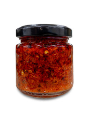 Chili sauce in glass jar isolated