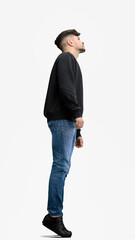 Naklejka premium A man, full-length, on a white background, looks into the distance