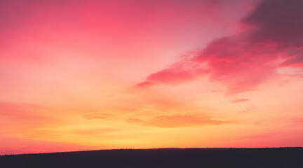 Fototapeta premium silhouette of a hill against a gradient sky that transitions from soft pink to deep orange