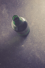 Beer bottle on dark table