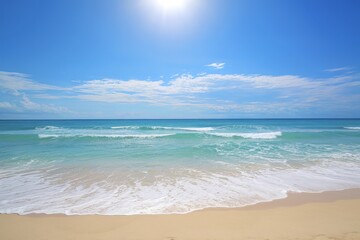 Fototapeta premium A pristine beach with golden sand leading up to the azure waters of the ocean