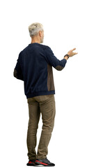 A man, full-length, on a white background, points to the side