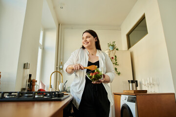 A plus size woman happily chops vegetables in her cozy kitchen.